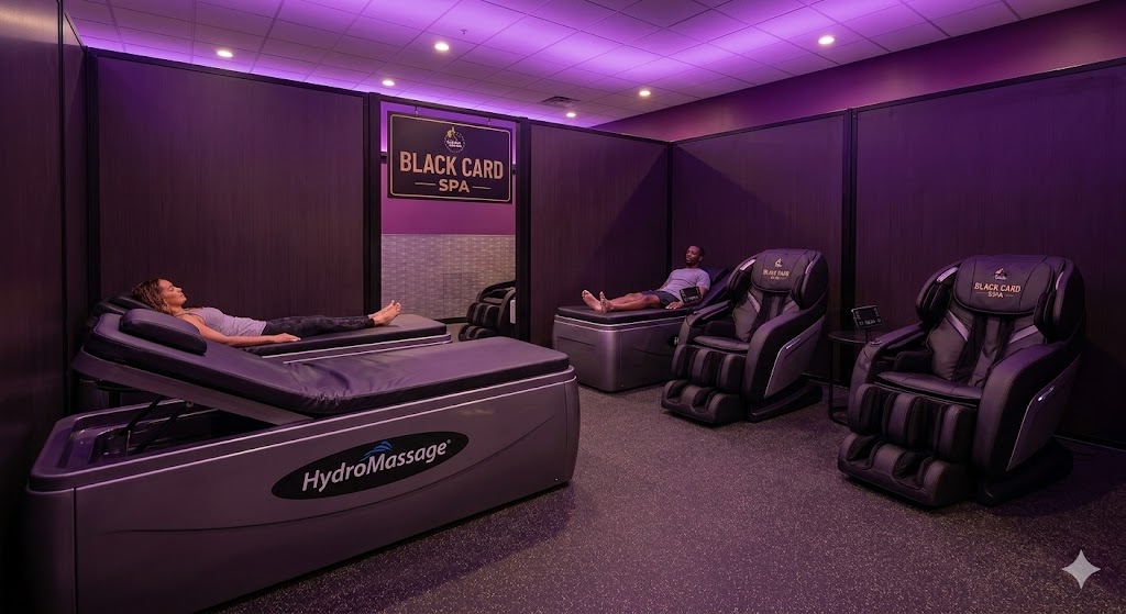 Planet Fitness Prices 2026: Interior view of the Planet Fitness Black Card Spa area featuring massage chairs and Hydro Massage beds.
